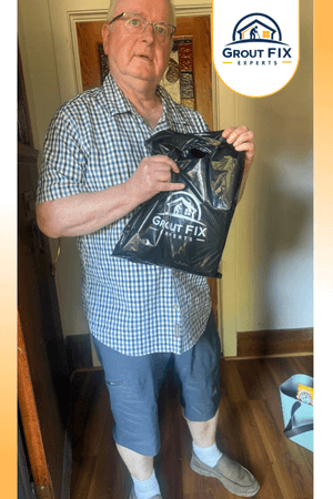 Man holding a GroutFix Experts maintenance kit.